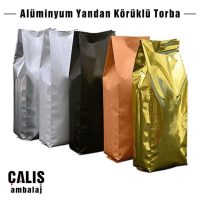 Beş farklı renkte Alüminyum Yandan Körüklü Ambalaj. Renkleri sırasıyla gümüş, beyaz, siyah, turuncu ve gold.