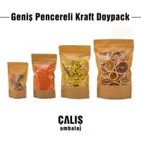 Dört adet Geniş Pencereli Kraft Doypack Ambalaj. İçlerinde sırasıyla şeker, mercimek, kurutulmuş çiçek ve kurutulmuş limon var.
