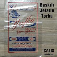 Fotoğrafta, bir masa üzerinde şeffaf bir jelatin poşet içinde bir yufka paketi görülmektedir. Poşetin üzerinde "Baskılı Jelatin Torba" yazısı ve "Çalış Ambalaj" logosu bulunmaktadır.