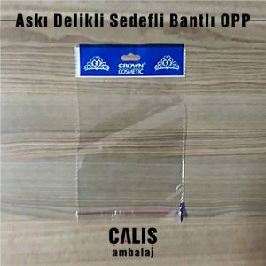 CROWN COSMETIC firma baskılı bantlı OPP torba. Askı delik kısmında beyaz sedef ve mavi renkli baskı mevcut.