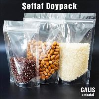 Kuruyemiş ve bakliyat içeren üç adet şeffaf doypack torba